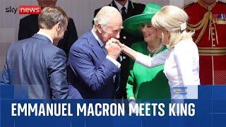 King greets Brigitte Macron with a kiss as French President begins three-day state visit